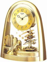 Rhythm Contemporary Mantel Clock Rotating Pendulum Shooting Stars Gold Gift